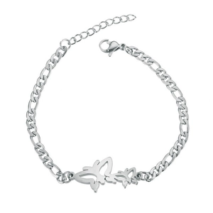 Detailed view of a silver butterfly charm on a stainless steel couple's bracelet