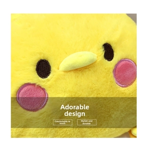 Close-up of soft yellow plush material with embroidered eyes and pink cheeks on bird backpack