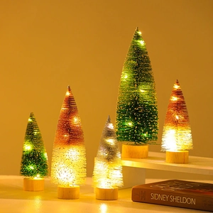 Miniature lighted Christmas trees with wood bases and warm LED strings for holiday decor