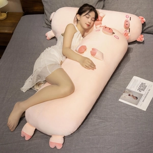 Pink cartoon long pig plush body pillow held by a girl on a cozy bed for sleeping