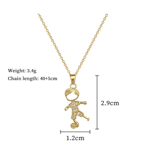 Macro detail of gold soccer boy pendant with dimensions and weight specifications