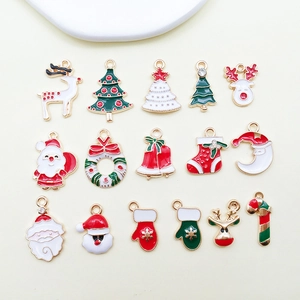 Set of 16 assorted Christmas alloy charms featuring Santa, tree, and reindeer designs