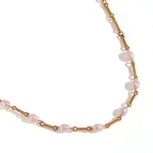 Minimalist 18K gold plated necklace with pink freshwater pearls on a white background