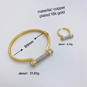 Pave crystal horseshoe screw bangle and ring set in 18k gold plated copper