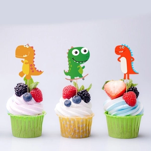 Three colorful cartoon dinosaur cupcake toppers on muffins for a jungle party decoration