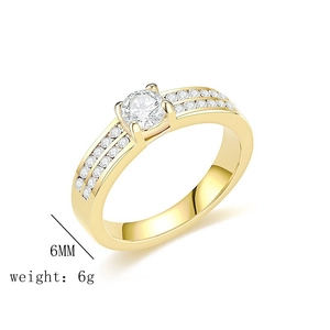 Close-up of a 6mm gold plated zircon ring featuring a round solitaire and pavé stones