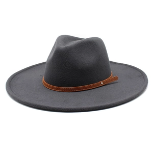 Detailed view of dark grey wool fedora hat featuring a slim brown leather band and stud