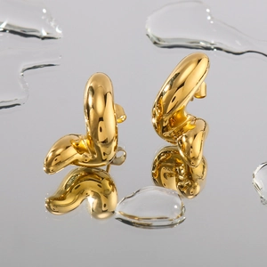 Artistic twisted gold stainless steel earrings with water drop reflections