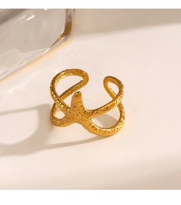 Macro shot of gold starfish ring with hammered texture and adjustable double band design