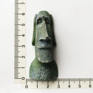 Detailed view of resin Moai statue souvenir with moss texture and size measurement