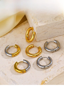 Close-up of 4mm minimalist 18k gold plated stainless steel hoop earrings on a stone