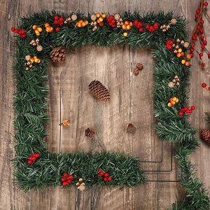 DIY Square Christmas wreath with green pine needles, red berries, and natural pinecones