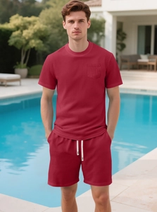Close-up of deep red waffle knit texture on men's t-shirt with functional chest pocket