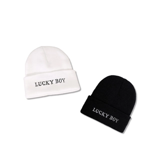 LUCKY BOY embroidered knitted beanie in black and white colors for winter warmth