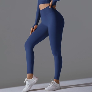 Detail of high-waist navy blue seamless yoga pants with thumb-hole sleeves athletic wear