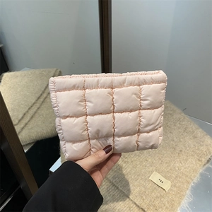 Pink quilted puffer clutch bag with classic checkered stitching and nylon texture