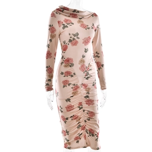 Detail of rose floral print and ruched texture on a pink long sleeve bodycon dress