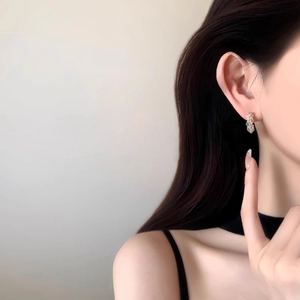 Silver needle C-shaped zircon earrings for women featuring a twisted vine design detail