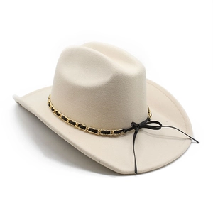 Detail of cream felt cowboy hat featuring gold chain band and elegant side bow tie