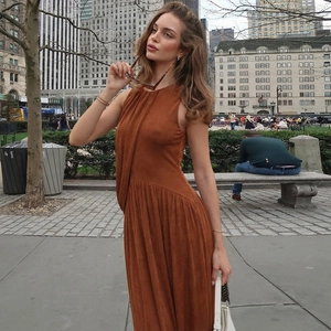 Detailed close-up of brown sleeveless halter neck dress showing thick textured fabric