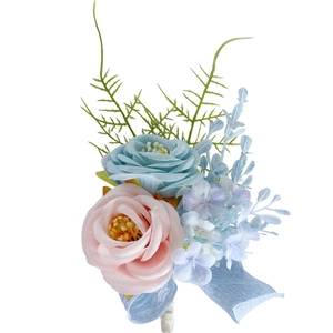 Pink and blue artificial rose boutonniere for weddings with green fern and blue ribbon