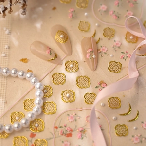 Golden hollow window pattern and pink floral nail stickers for elegant manicures