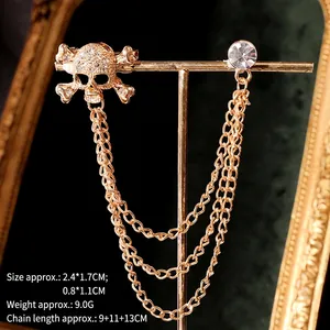Gothic skull collar chain brooch with gold tassels and crystals on vintage display stand