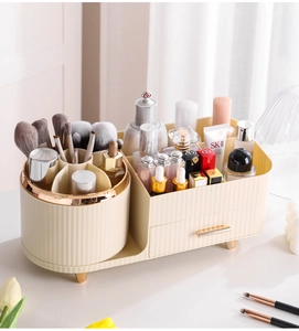 Detail view of cream makeup organizer with 360-degree rotating brush holder and gold accents
