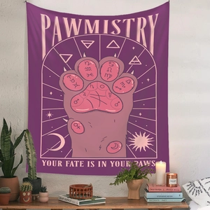 Detail of Pawmistry tapestry with mystic purple paw print and astrology symbols