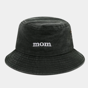 Close-up of MOM embroidery and metal eyelets on washed cotton dark grey bucket hat