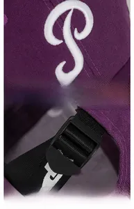 Detail of purple cotton baseball cap with 3D white P embroidery and adjustable back strap