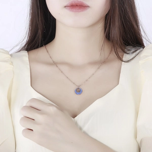 Minimalist gold titanium necklace with blue enamel pendant featuring a cute mouse design