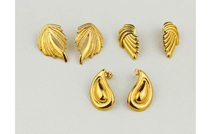 Detailed view of three pairs of 18K gold-plated stainless steel geometric stud earrings