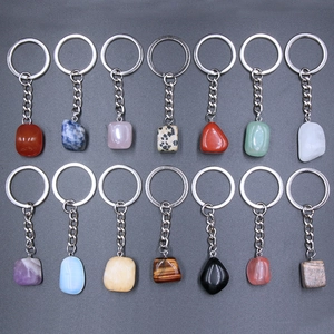 Collection of irregular natural crystal and agate stone keychains in diverse colors