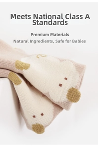 Close-up of baby floor socks featuring cute cartoon bear pattern and soft knit texture