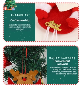 Detail of red felt Christmas reindeer ornament with gold Merry Christmas lettering and tassel