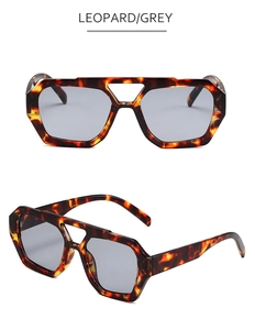 Detail view of leopard geometric sunglasses with double bridge and grey lenses