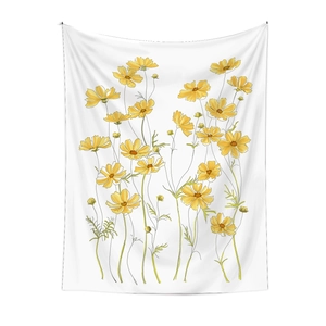 Detailed close-up of yellow floral hand-drawn patterns on a white decorative wall tapestry