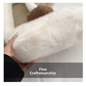 Detail view of the soft faux fur texture and contrast brown trim on the plush handbag