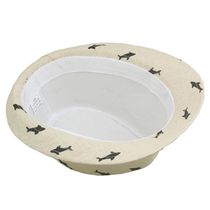 Close-up of beige paper straw hat inner band showing 100% paper material label