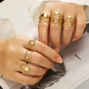 Stackable 18k gold plated stainless steel rings featuring heart and star motifs on a model