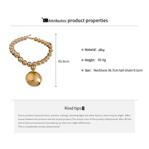 Detailed view of chunky golden beaded necklace with length and weight specifications