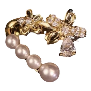 Elegant gold butterfly ear cuff with zircon and double-layer pearls on white background