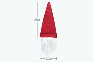 Detail showing 23cm height of a Christmas gnome wine bottle cover with red felt hat