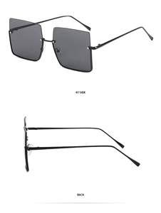 Detail view of large square black sunglasses showing 45 degree side and back metal temples