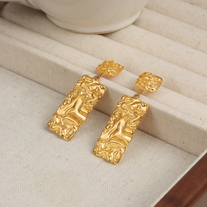 Golden double-layer geometric earrings with irregular lava texture in titanium steel