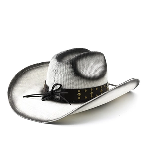 Detail of white straw cowboy hat with black spray edge and studded leather band