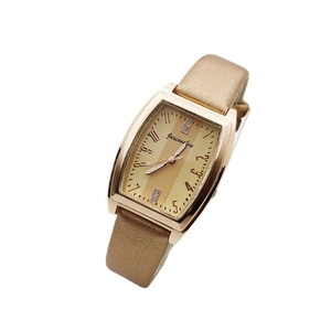 Vintage gold tonneau quartz watch with diamond markers and champagne striped dial