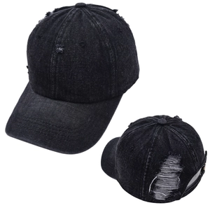 Close-up of distressed denim baseball cap with torn details and adjustable strap