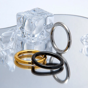 Three-piece minimalist polished titanium steel rings in gold, black, and silver finishes